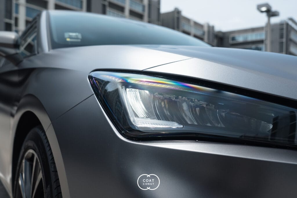 Close-up of a SEAT Leon with a grey vinyl wrap